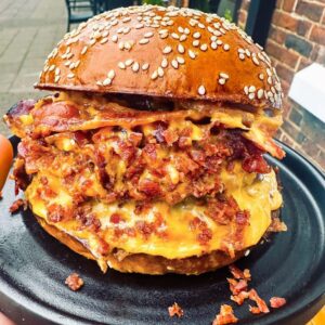 THE CHEESIEST BACONIST BURGER IN THE LAND!